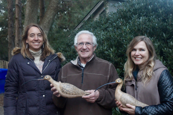 South Carolina Wildlife Biologist Felicia Sanders, Decoy Carver Pat Campbell, and Smithsonian Research Ecologist Autumn-Lynn Harrison with Mr. Campbell's exquisite Long-billed Curlew wooden decoys.
